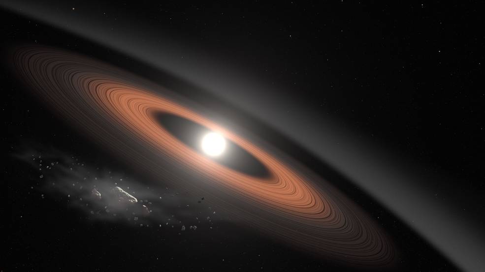 In this illustration, an asteroid breaks apart under the powerful gravity of LSPM J0207+3331, a white dwarf star located around 145 light-years away. Scientists think crumbling asteroids supply the dust rings surrounding this old star. - Image Credit: NASA’s Goddard Space Flight Center/Scott Wiessinger