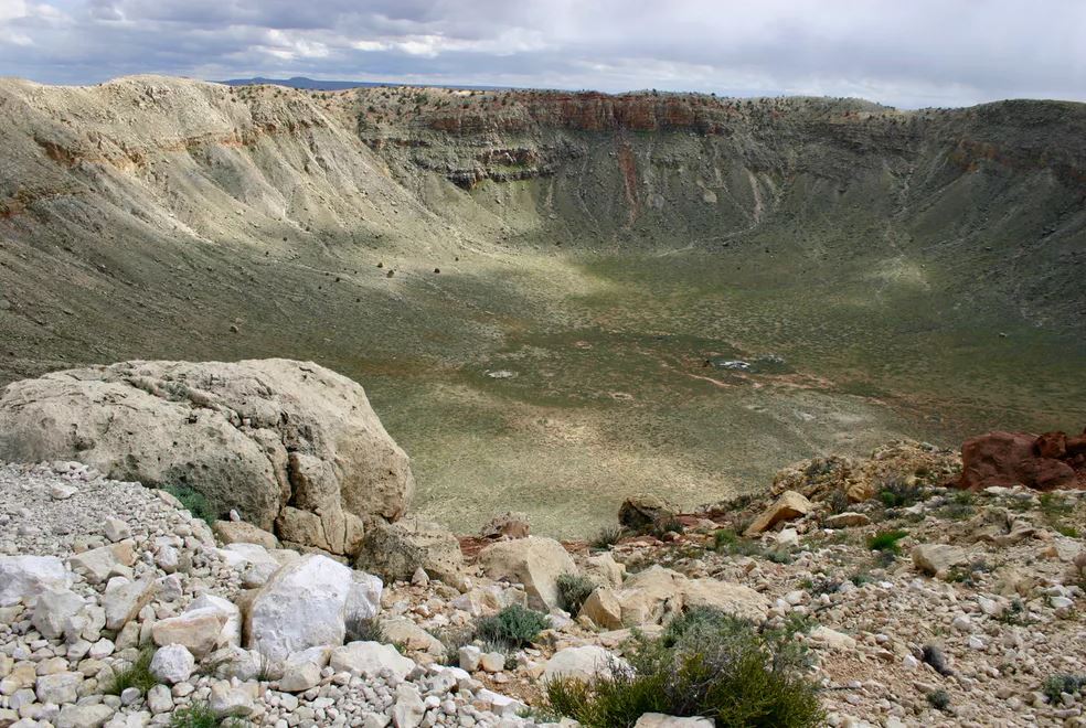 This meteor crater in Arizona was created 50,000 years ago when an iron meteorite struck the Earth. It is about one mile across. - Image Credits: W. Herbst, CC BY-SA