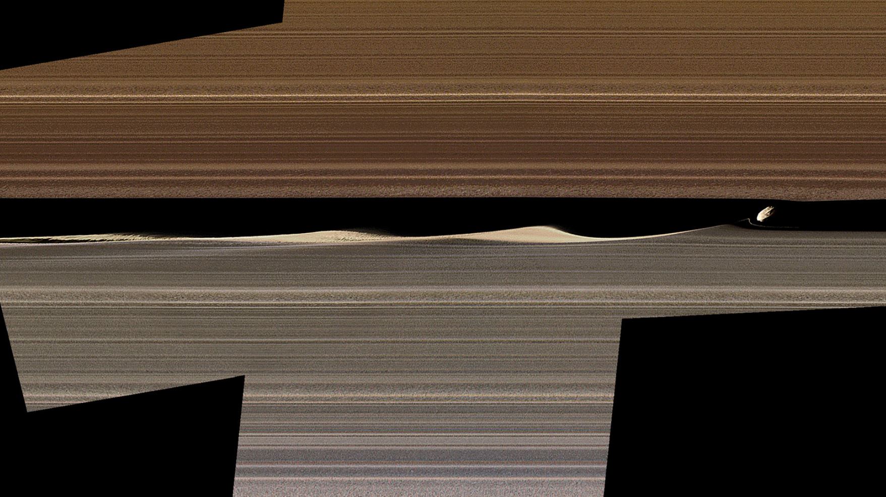 A false-color image mosaic shows Daphnis, one of Saturn's ring-embedded moons, and the waves it kicks up in the Keeler gap. Images collected by Cassini's close orbits in 2017 are offering new insight into the complex workings of the rings. - Image Credits: NASA/JPL-Caltech/Space Science Institute