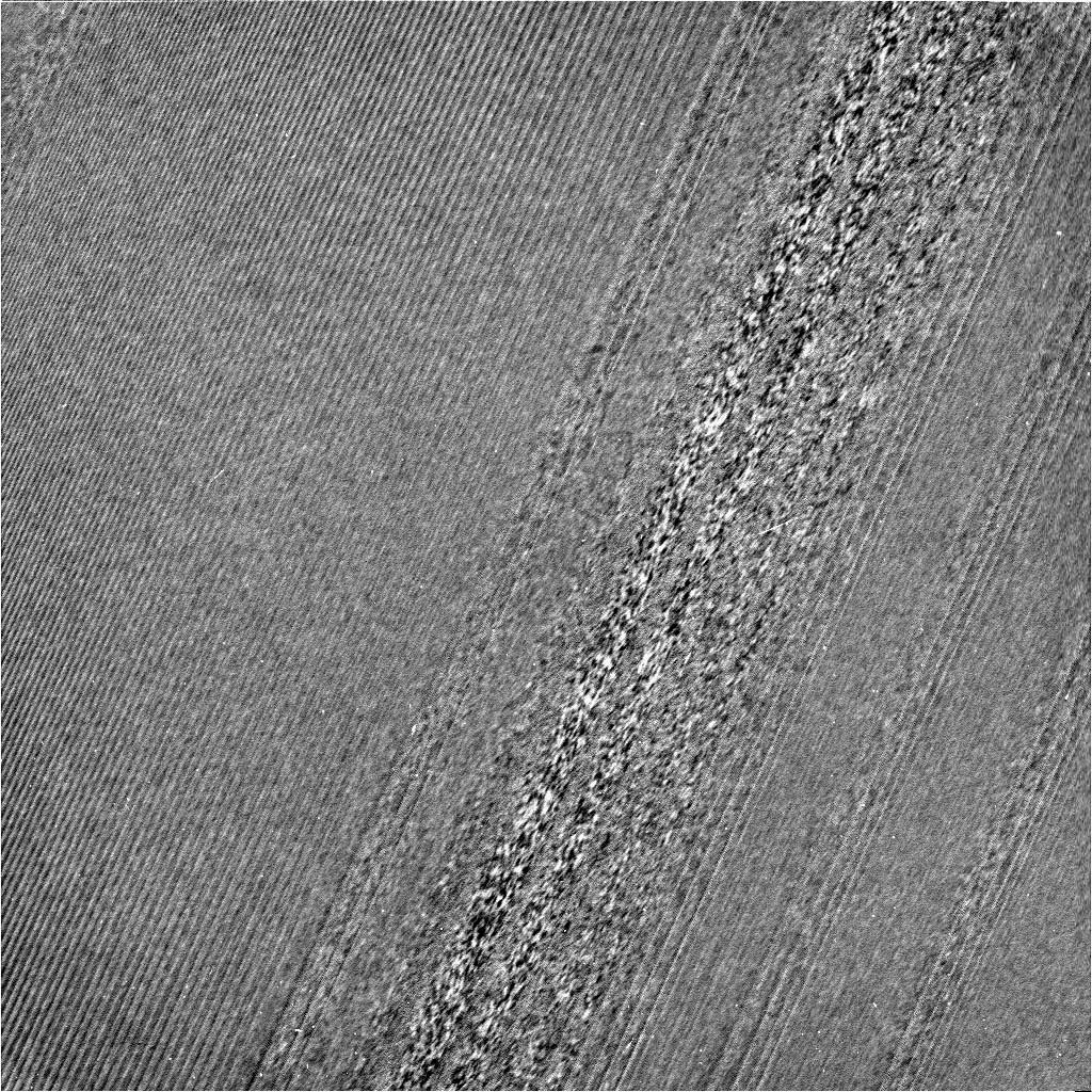 This image has been filtered so that the newly visible strawlike textures and clumps are more visible. - Image Credit: NASA/JPL-Caltech/Space Science Institute