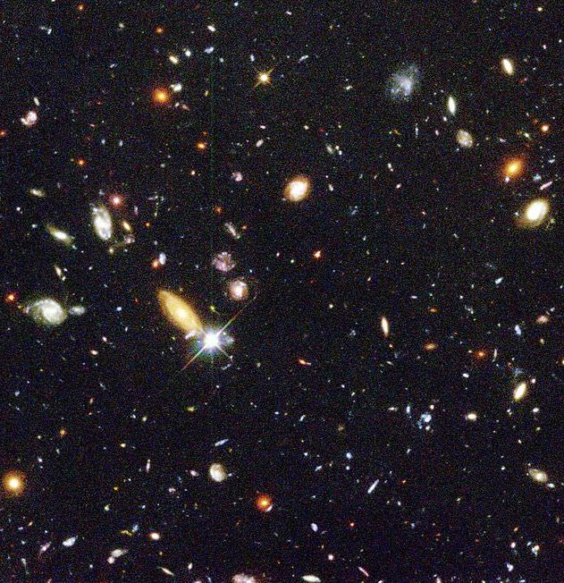 It’s a little grainy by today’s standards, but this image of the Hubble Deep Field is one of those iconic space images. Add a few asteroid streaks and it looks kind of like the parallel field image of Abell 370. - Image Credits: NASA/ESA/Hubble.
