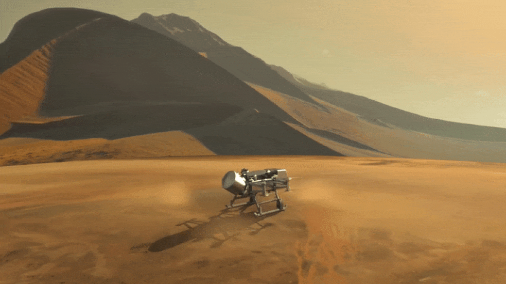 This illustration shows NASA’s Dragonfly rotorcraft-lander approaching a site on Saturn’s exotic moon, Titan. Taking advantage of Titan’s dense atmosphere and low gravity, Dragonfly will explore dozens of locations across the icy world, sampling and measuring the compositions of Titan's organic surface materials to characterize the habitability of Titan’s environment and investigate the progression of prebiotic chemistry. - Image Credits: NASA/JHU APL