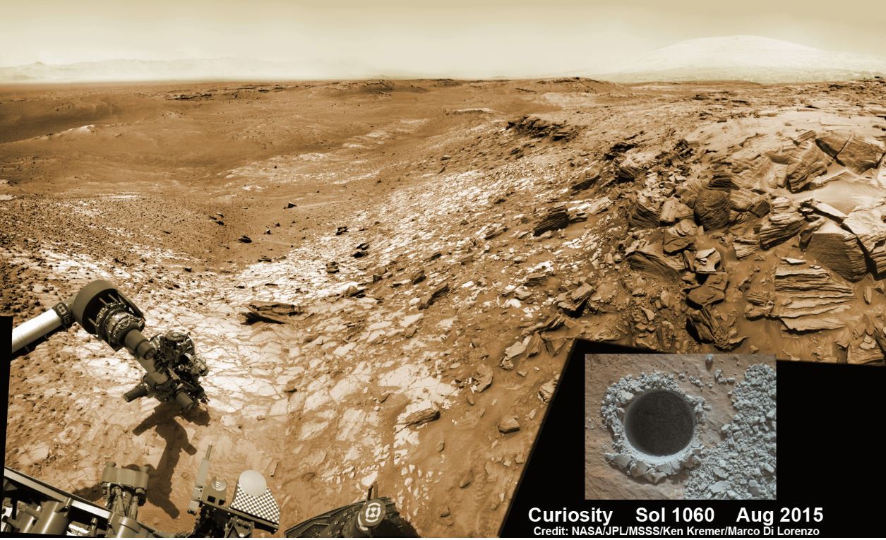 Curiosity extends its robotic arm and conducts sample drilling at the “Buckskin” rock target at the bright toned “Lion” outcrop at the base of Mount Sharp on Mars, seen at right. The eroded rim of Gale Crater is in the distant background at left, in this composite multisol mosaic of NavCam raw images taken to Sol 1059, July 30, 2015. NavCam camera raw images are stitched and colorized. Inset: MAHLI color camera up close image of the full depth drill hole at the “Buckskin” rock target on Sol 1060. - Image Credits: NASA/JPL-Caltech/MSSS/Ken Kremer/kenkremer.com/Marco Di Lorenzo