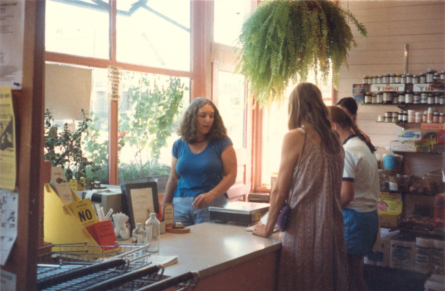 late 80's Joyce running the check out 001.jpg