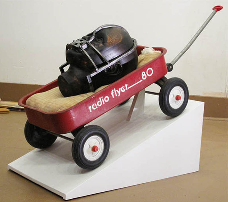 mao_14.jpeg_the weight of memory 2012. carved wood forged steel pillow rust radio flyer stain wax. 12x40x14 inches..jpg