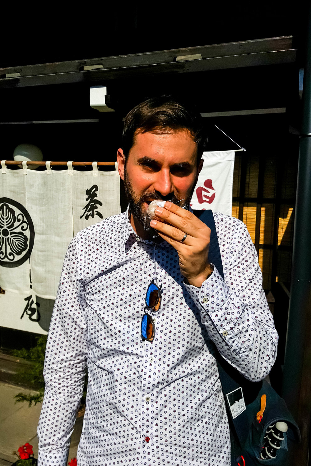 Eating daifuku on Sanmachi Suji street, Takayama