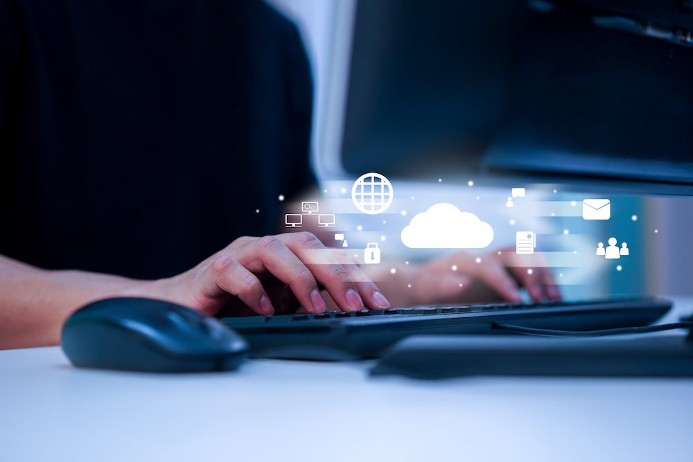 ladies fingers at a keyboard with cloud symbol