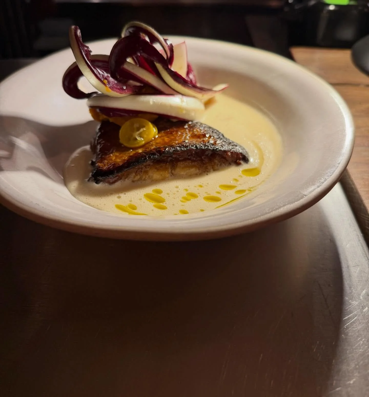 GRILLED COD, LEMON BEURRE BLANC, KANZURI, TREVISO, PICKLED KUMQUAT 🤯

Very very happy to embark on a 12 week&rsquo; journey with @chefthomlemercier 
First menu is slick, sharp, different, delicious, classic but not classical!

Stay warm x