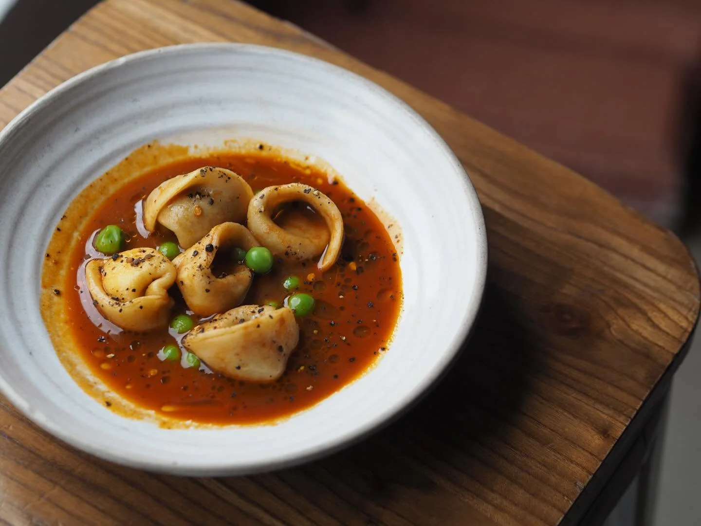 BLACK GARLIC &amp; RICOTTA TORTELLINIS IN BOUILLABAISSE @malik__bouzid 🚀

Drink it until it&rsquo;s all gone. 
Pair with a glass of Sicilian Frappato @lamorescavini x