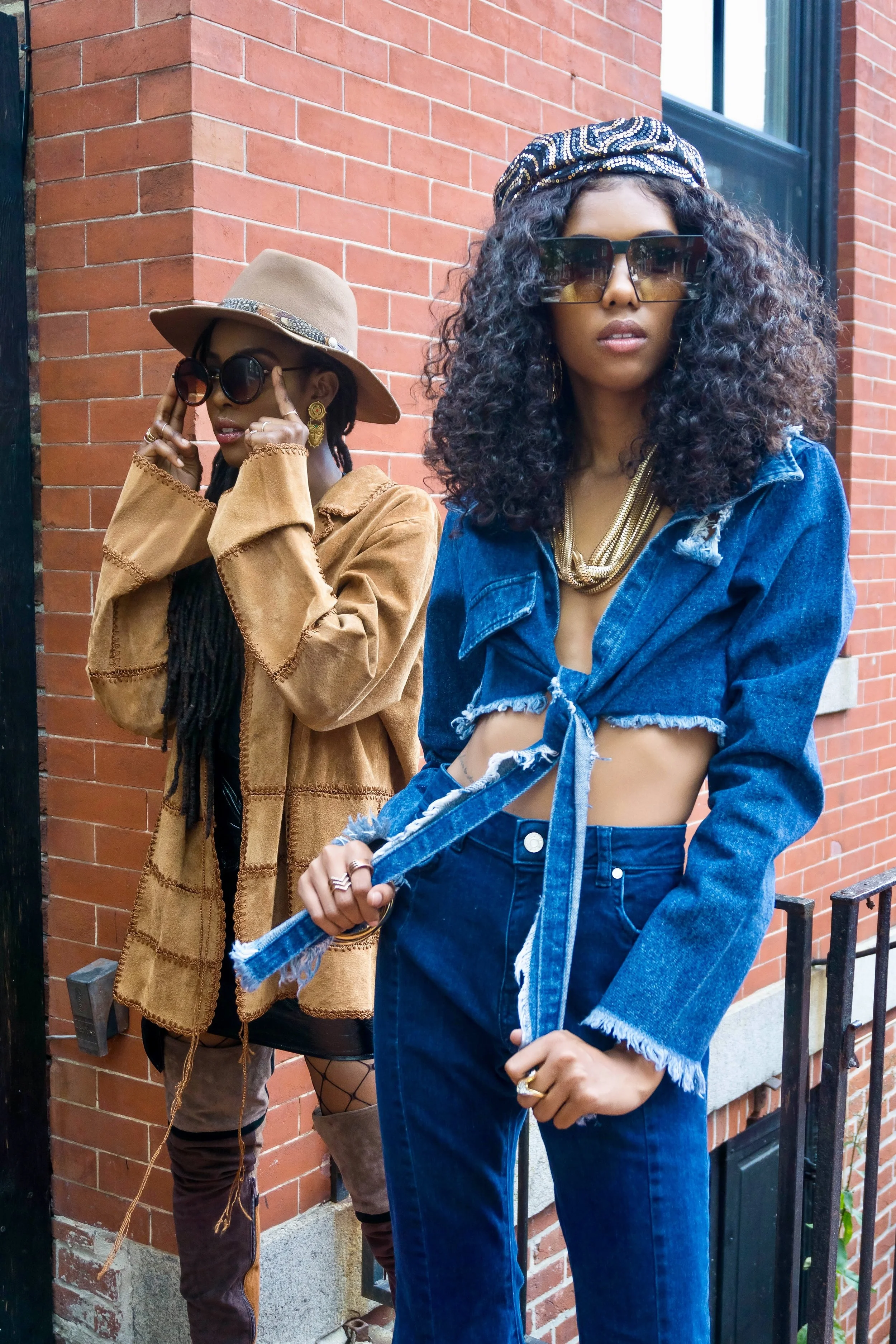 What's The Move? Tenea is wearing a vintage Suede in Texas patchwork oversized jacket , lace plunging neckline bodysuit , Missguided faux leather belted mini skirt , Jeffrey Campbell colorblock thigh high boots , vintage brim hat, jewelry, and circle frame shades. Dominique is wearing the Off the Edge denim crop top by Naked Wardrobe, Missguided blue mid rise extreme flare skinny jeans , denim caged ankle boots , vintage sequin beret, Missguided 99 problems earrings and Pretty Little Thing sunglasses , Forever 21 bangles, necklace from my wardrobe collection. 