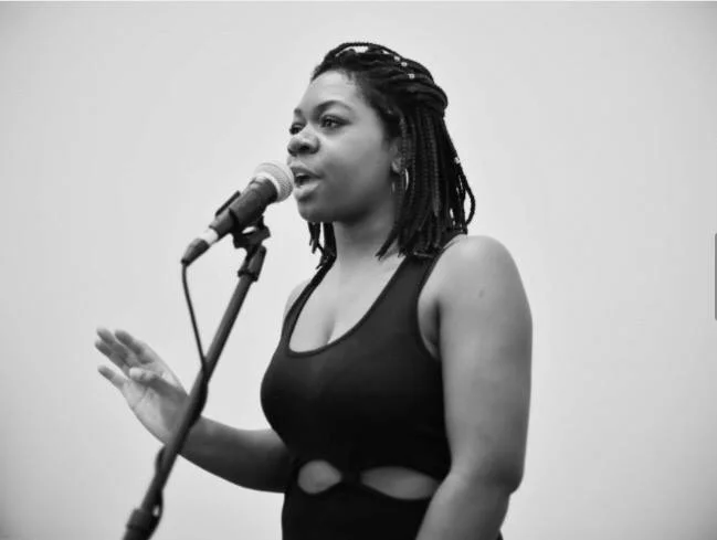 Charlotte Abotsi, Co-Director A former Youth Grand Slam Champion, Charlotte Abotsi has taken on a directorship role at her home venue, the Providence Poetry Slam. There, she serves as a youth director, booking coordinator, and slam master. She has competed in several international slams, and most recently placed in the top 20 at the 2016 Women of the World Poetry Slam. She is 1/2 of The Rush Hour Poetry Tour Collective, a collective demanding intersectionality at every avenue. Her poems have been written about in The Huffington Post and Mic.com. 