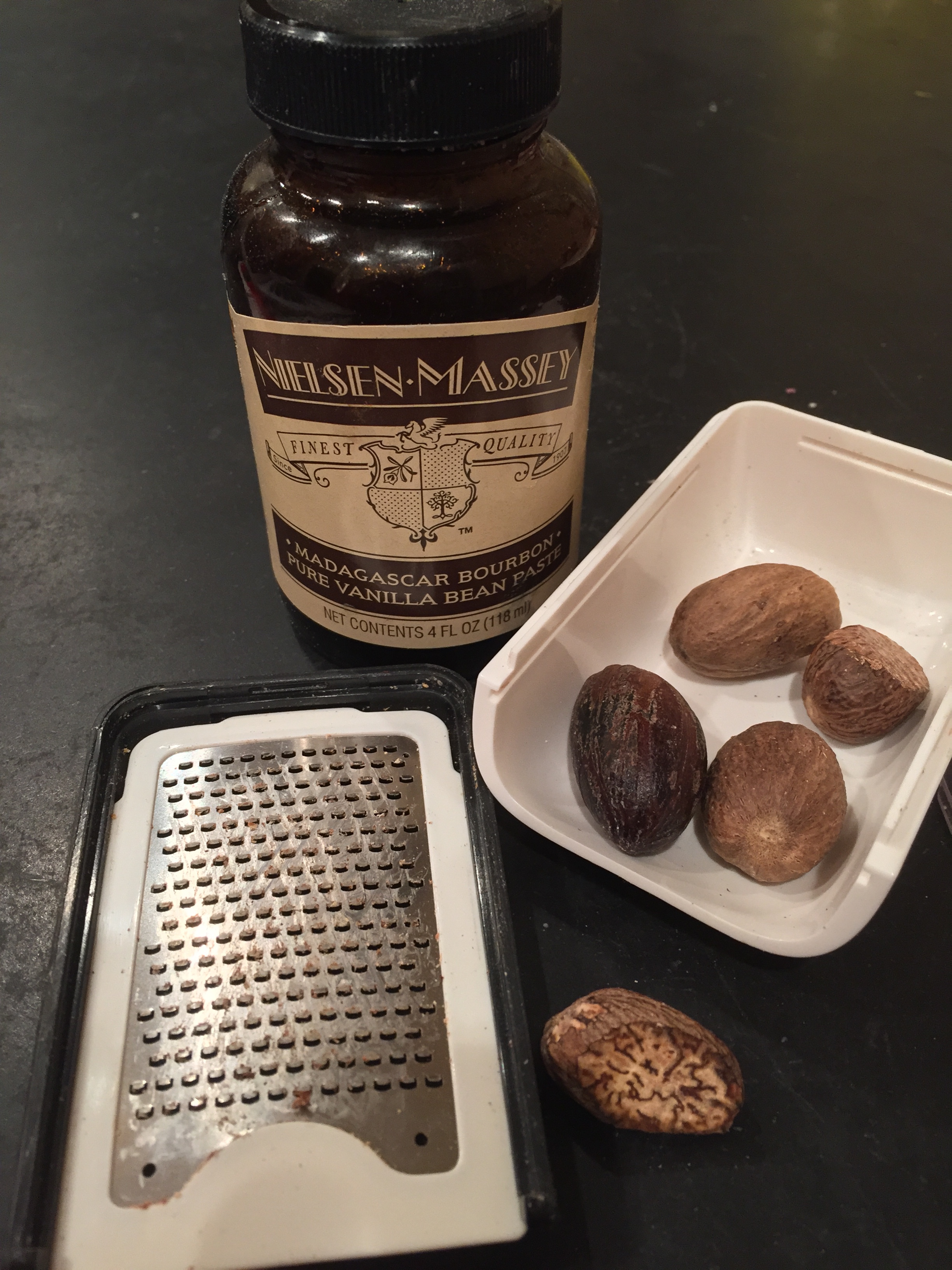 Nielsen-Massey Madagascar Bourbon Pure Vanilla Bean Paste hanging out with my nutmeg grater (yes, such a thing exists) and whole nutmegs. Aren't they cool looking inside? 
