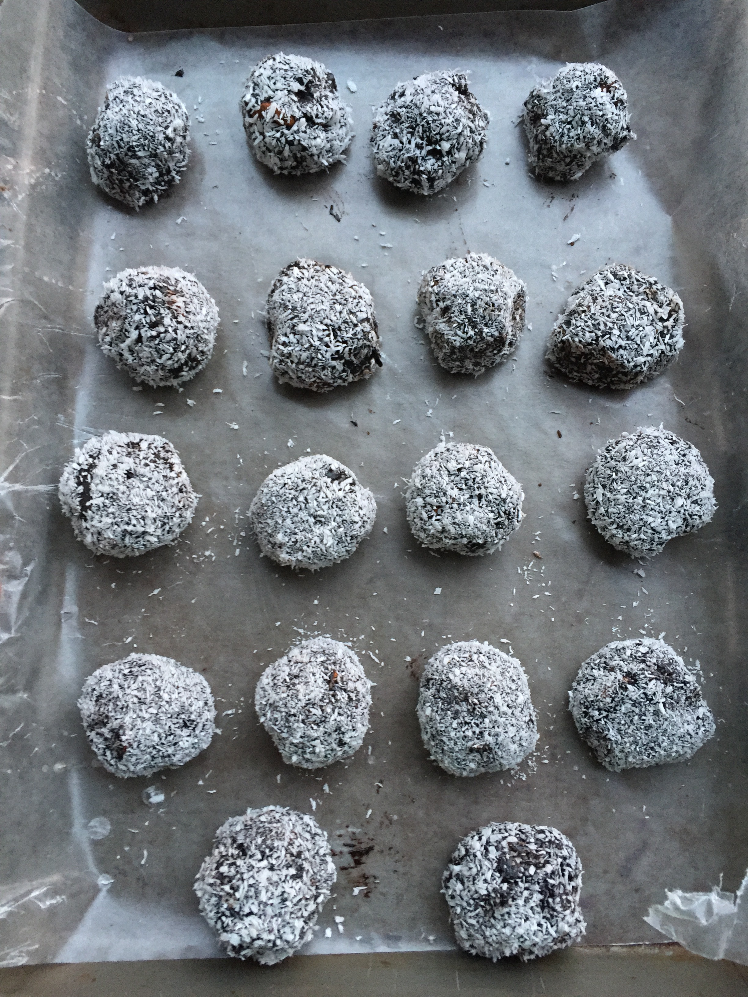 Snowy looking vegan almond date balls, ready for the fridge. 