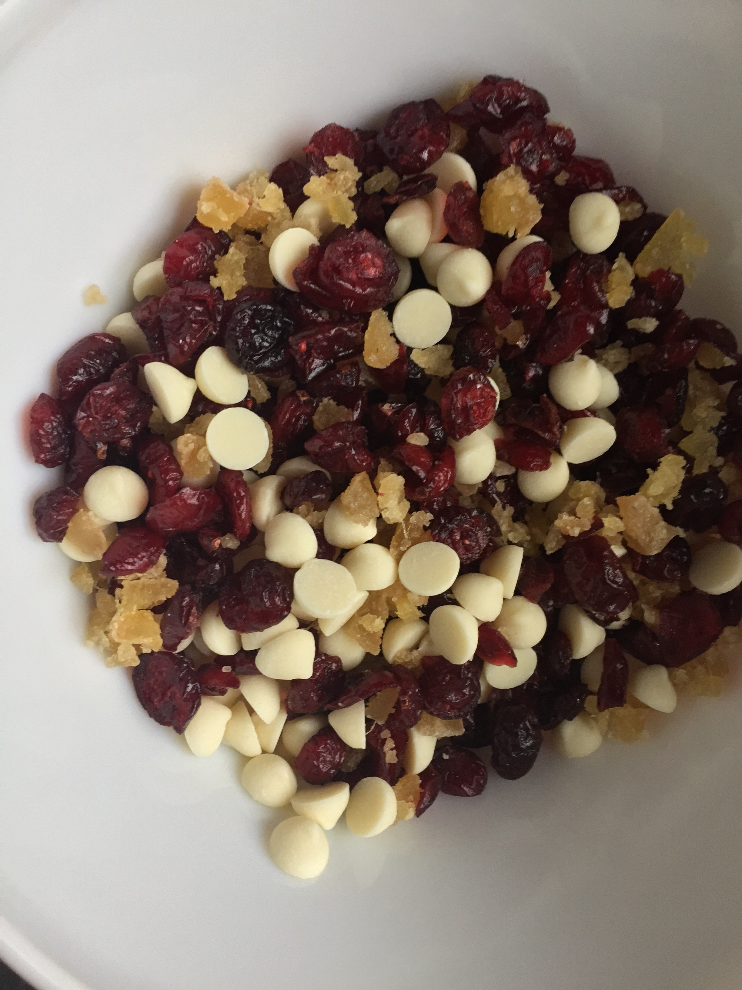 Cranberries, white chocolate, and finely chopped crystalized ginger for Ultimate Spiced Holiday Granola.