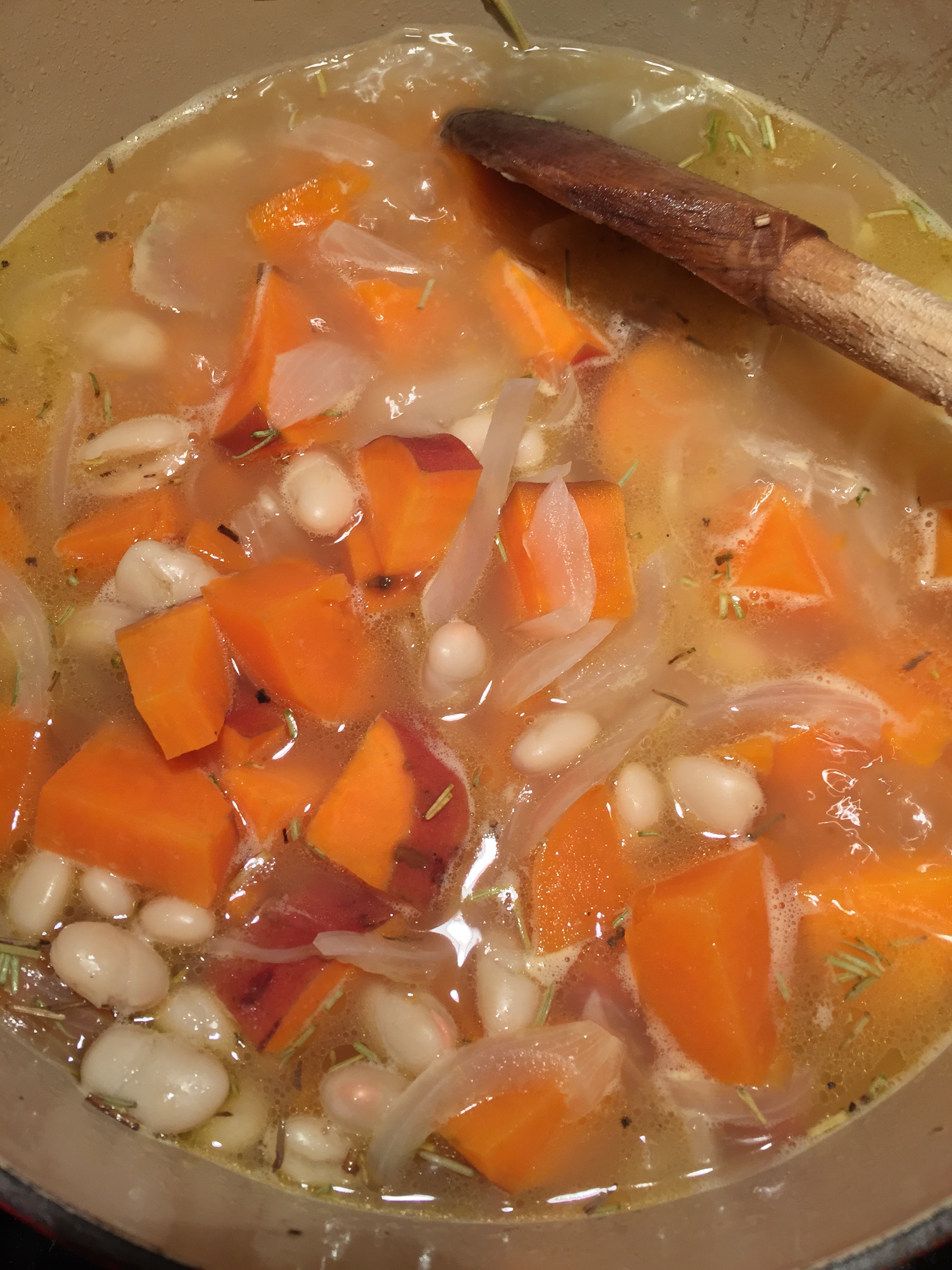 Sweet potatoes, white bean and pesto. There's also some rosemary in there, too. And of course all good things begin with a sauteed onion. 