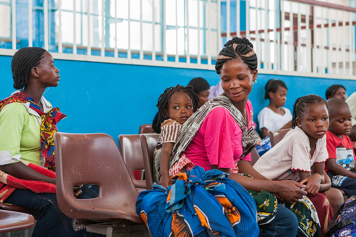 Entire families wait the Tazara Express at the station. Zambia