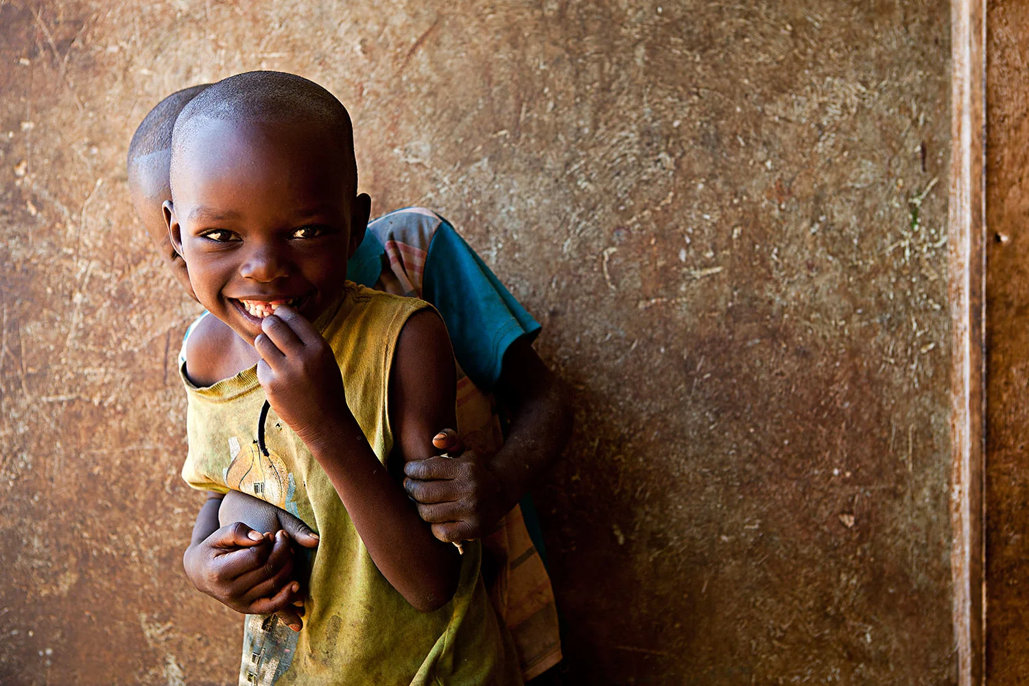 Kids playing outside they house in a small village in Zambia