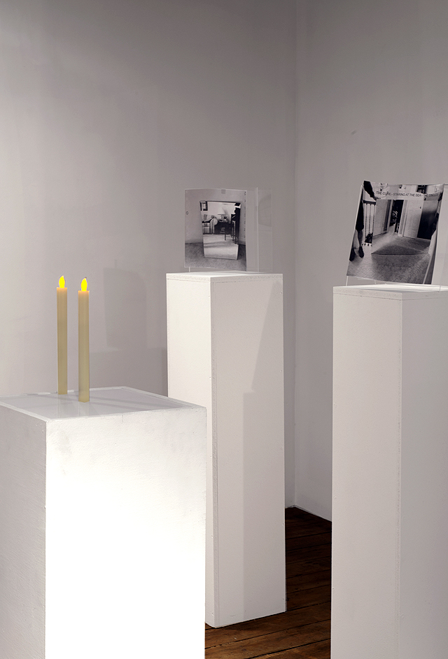 The Room of Requirement (Installation detail), 2015. Photocopies, plexiglass, pedestal, tape, toilet paper, and electric candles. Dimensions Variable