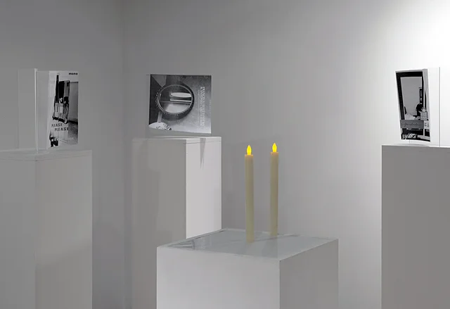 The Room of Requirement (Installation detail), 2015. Photocopies, plexiglass, pedestal, tape, toilet paper, and electric candles. Dimensions Variable
