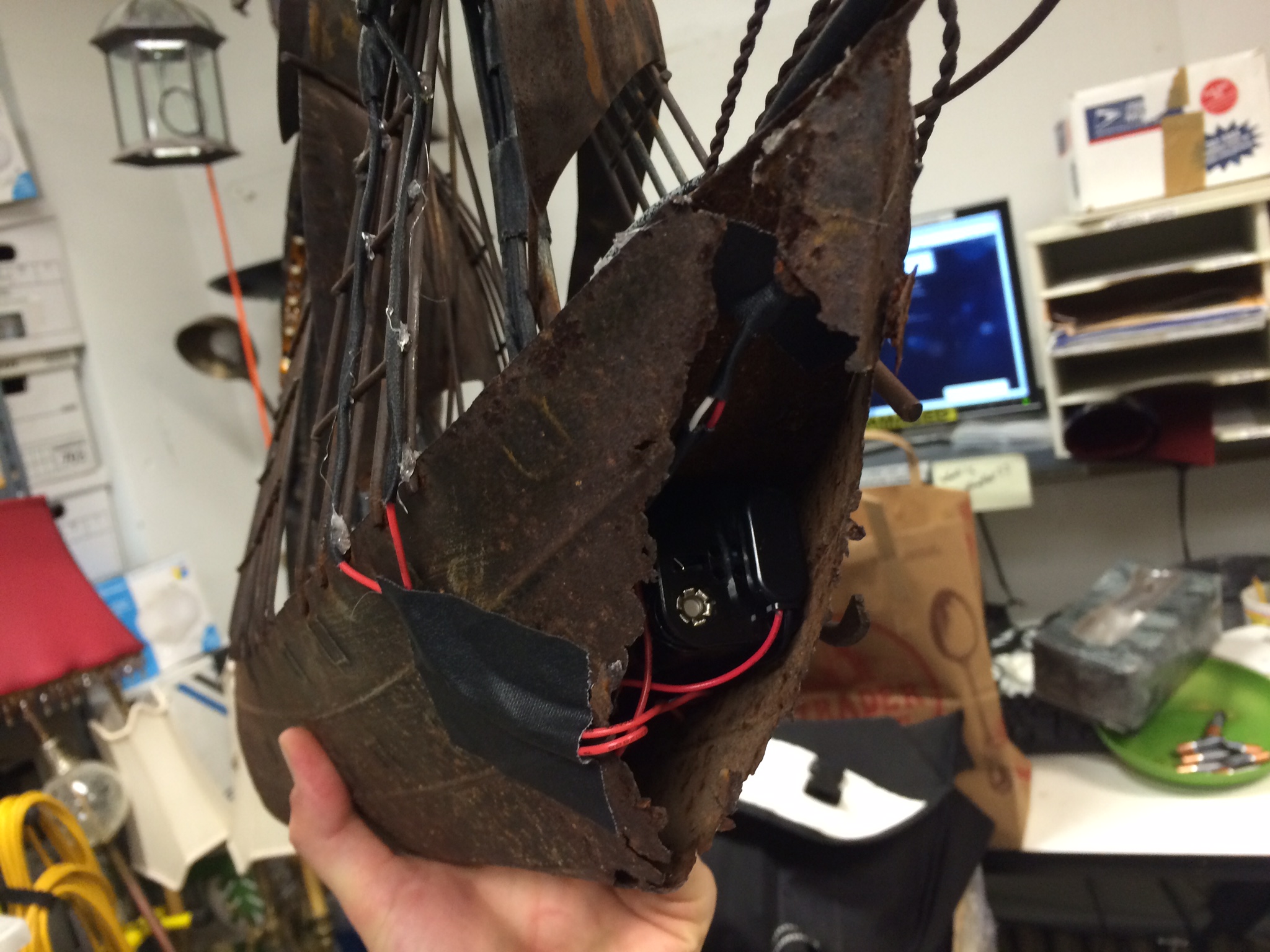I placed a battery pack that powered the LED tape inside the hull of the ship. A switch on the back of the ship, controllable by the actor, turned the LED lights on and off.