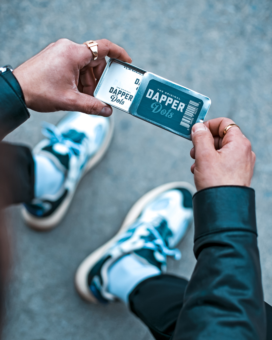 Close-up of Erik Wertz sliding open a pack of fearless tape Dapper Dots