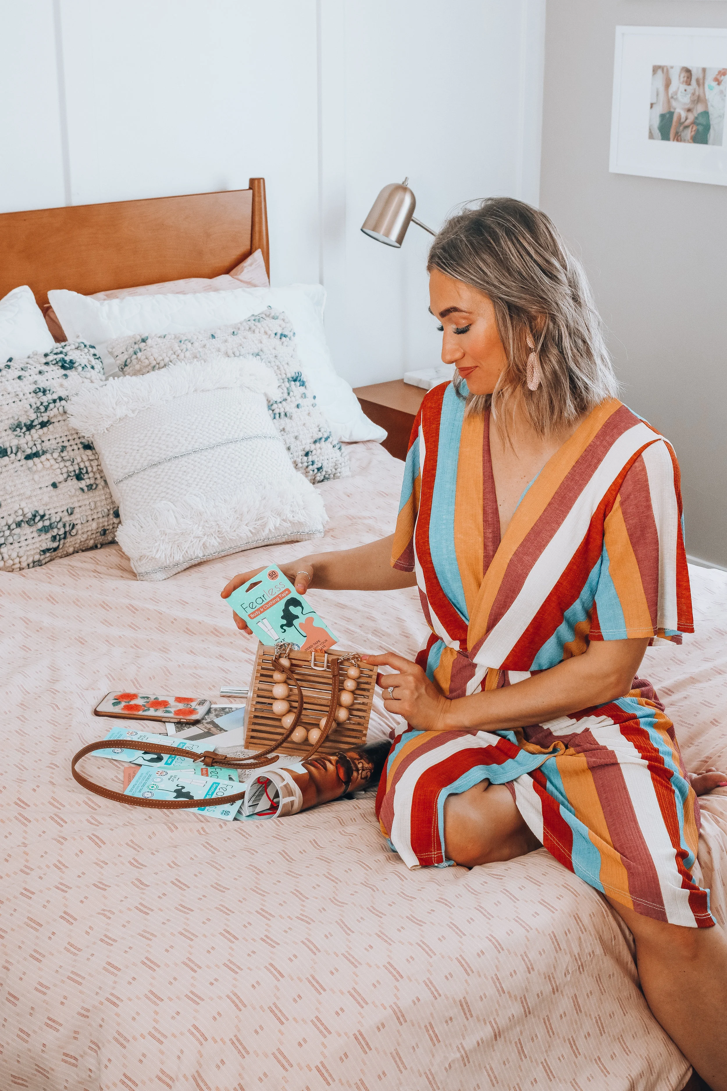Karlee Andrews pulls a pack of fearless fashion tape out of her purse