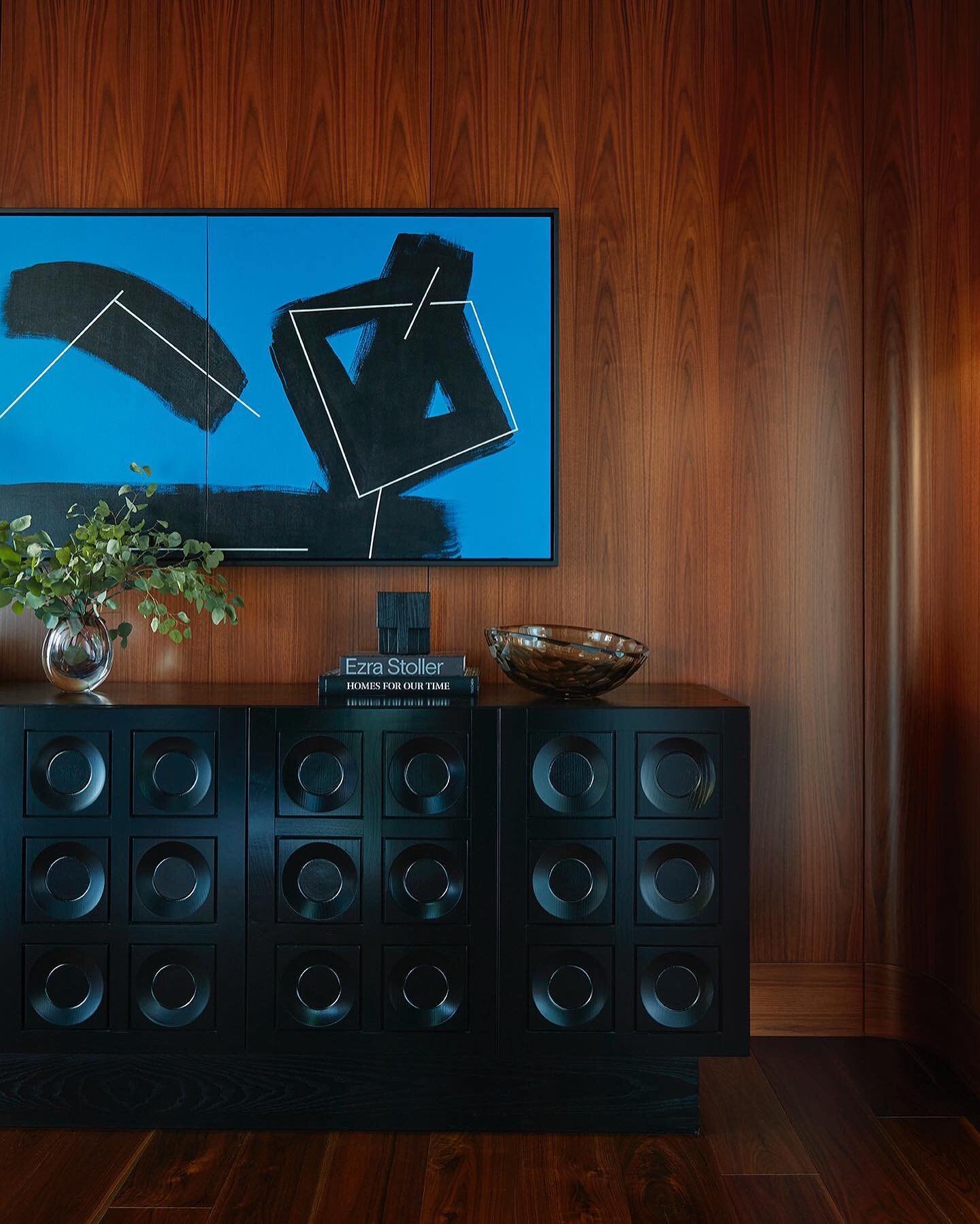 BLACK &amp; BLUE
.
A 1991 painting by Blaine Mitchell hangs above a vintage ebonized cabinet from @morentz_gallery in the primary bedroom in our Lake Tahoe residence.
.
📷 @rogerdaviesphotography 
.
#blackandblue #laketahoe #inclinevillage #nevada #l