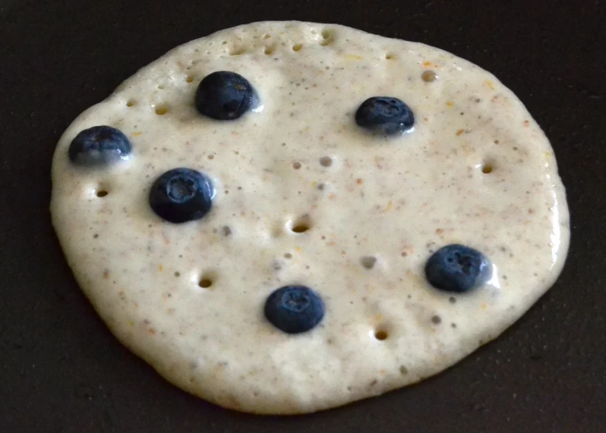 Pop the blueberries into the top of the batter in the pan.jpg