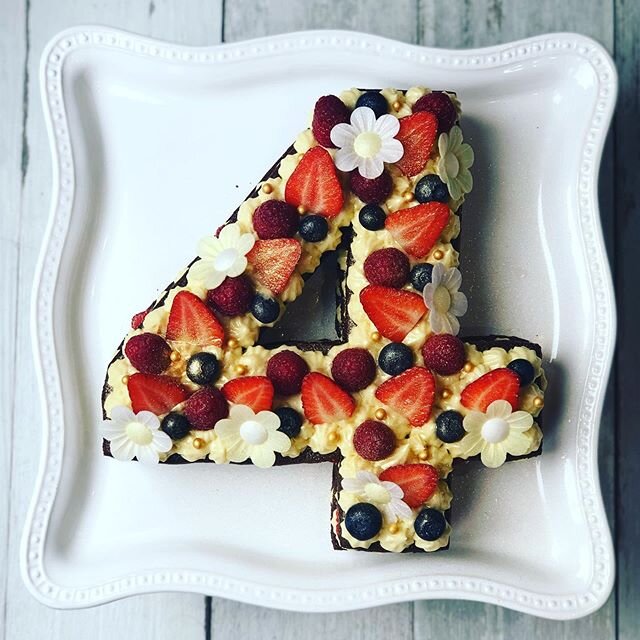 Fruit &amp; flowers for a very special 4th anniversary. Three layers of chewy Nutella cookie sandwiches with vanilla creme pat &amp; fresh berries. Wafer flowers, gold sprinkles &amp; gold glitter on the top layer as well. I absolutely adore these ca