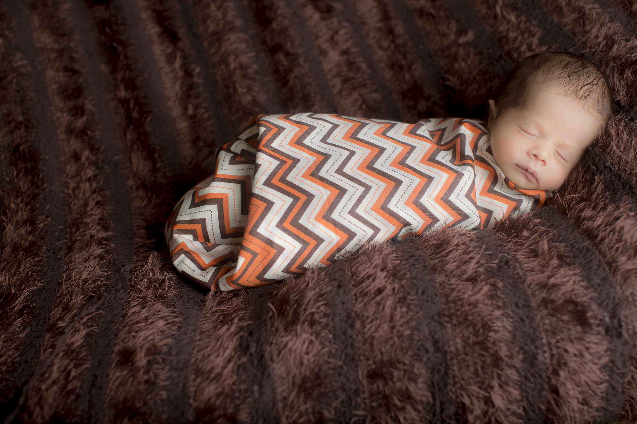 10 modern newborn boy swaddled in chevron studio session.jpg