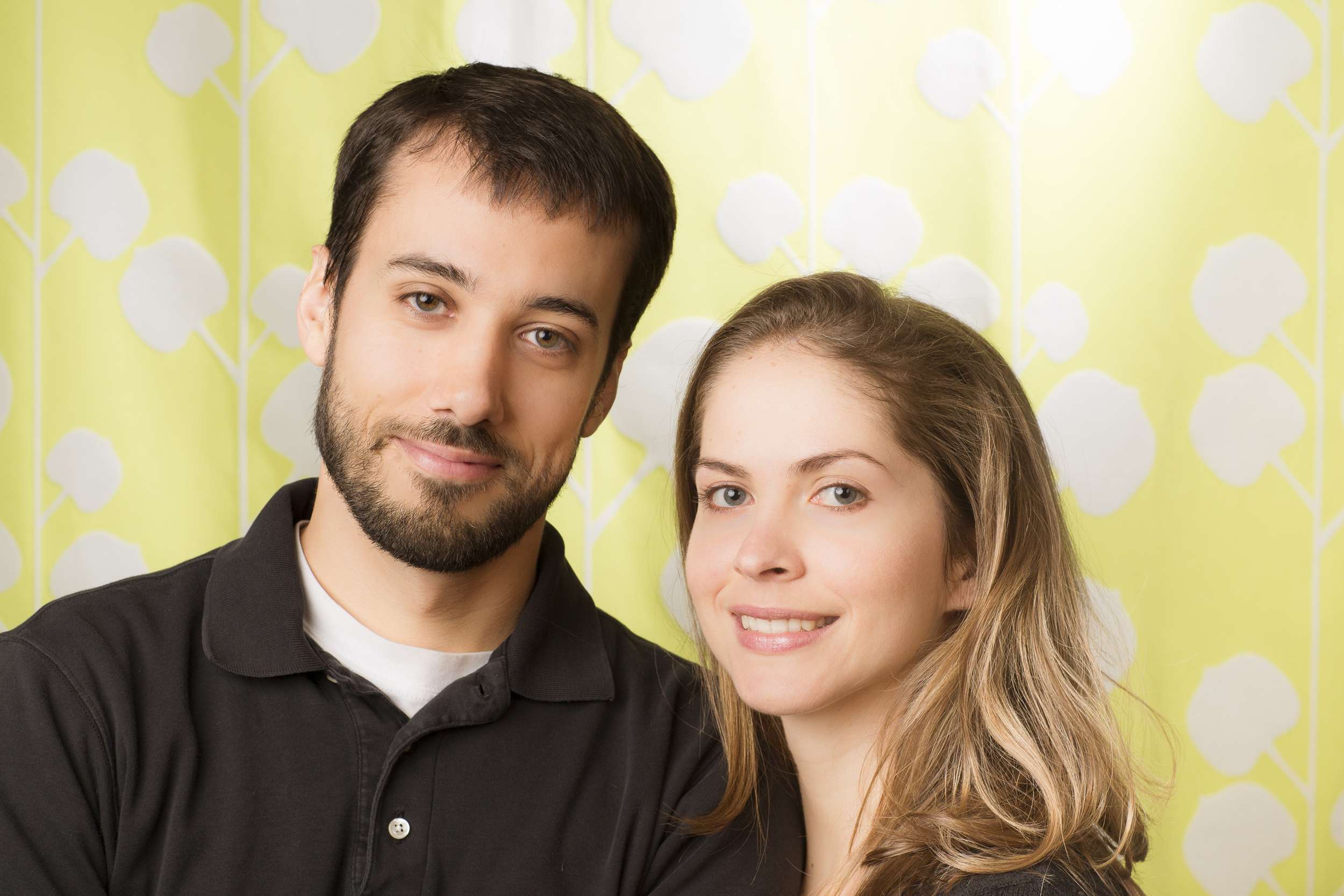 14 young couple family portrait studio session on green background.jpg