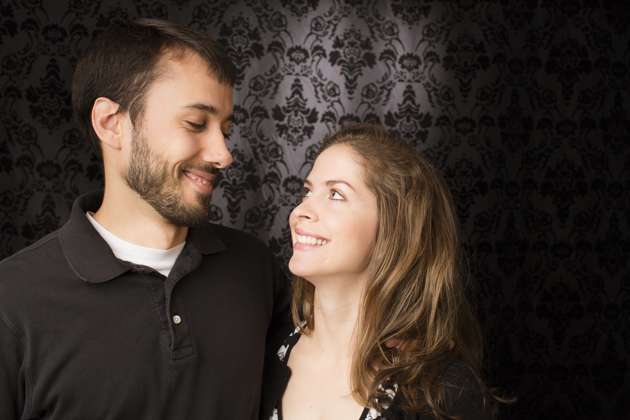 37 young couple family portrait studio session on black modern background.jpg