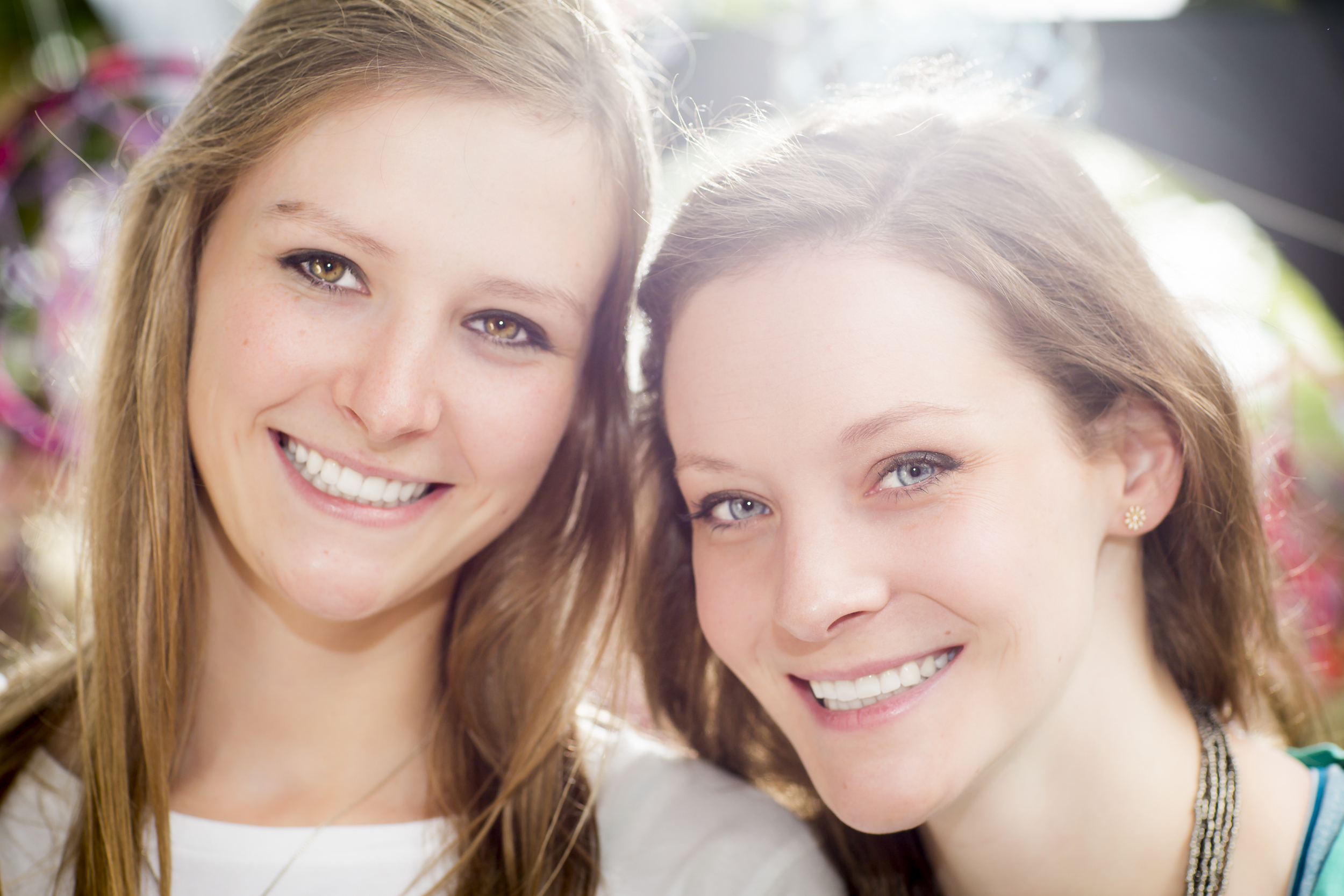 35 2 sisters family portrait outdoor session vibrant dream catchers up close.jpg