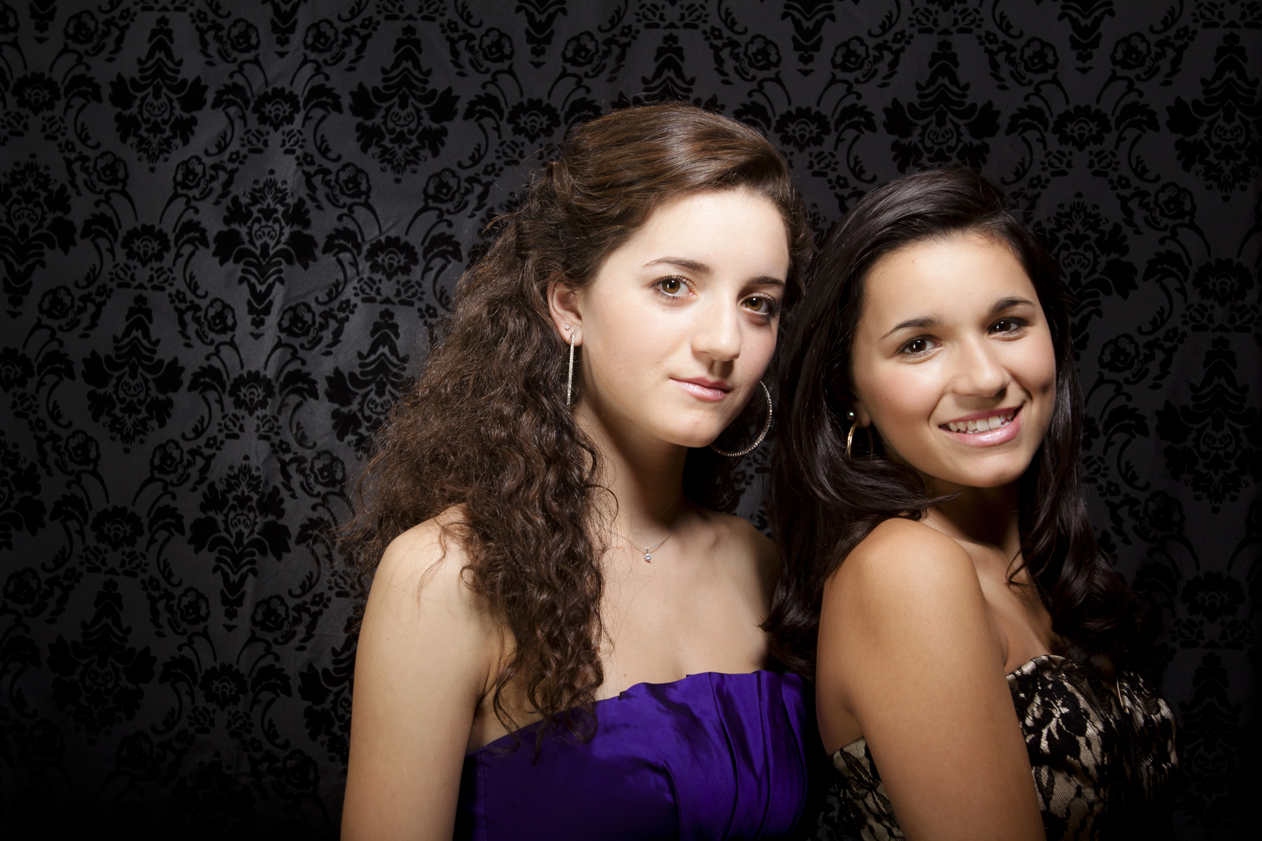 modern styled family portrait session prom dress sisters on black background 2.jpg