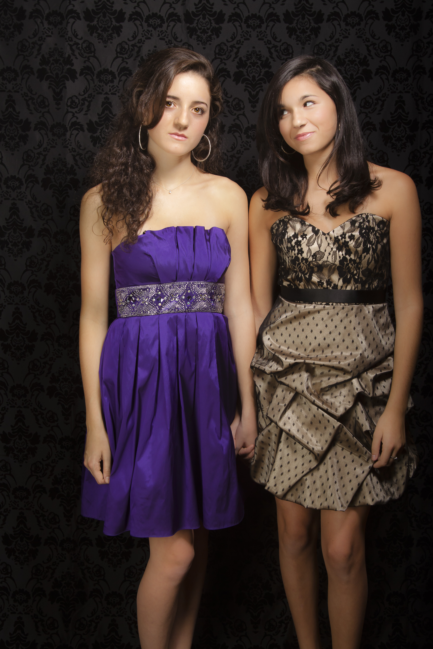 modern styled family portrait session prom dress sisters on black background.jpg