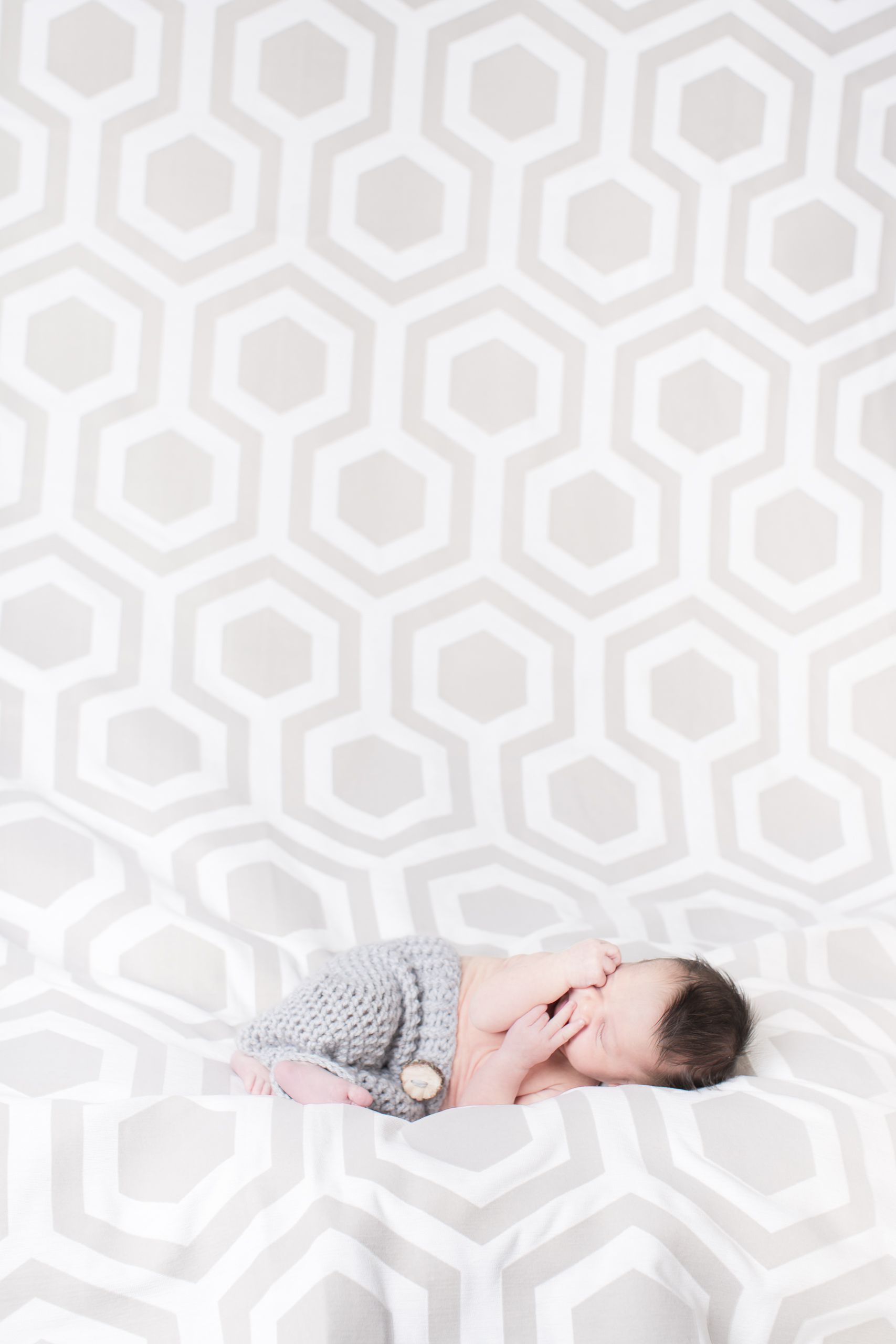 06 modern newborn baby boy in kint bottoms modern hexagon backdrop studio photography session.jpg