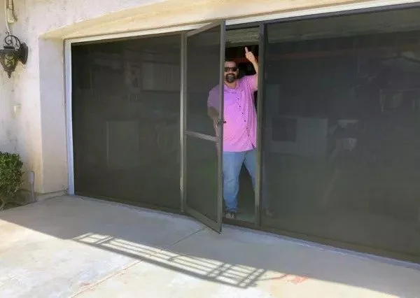 Lifestyle garage screen with optional swinging entry/exit door.