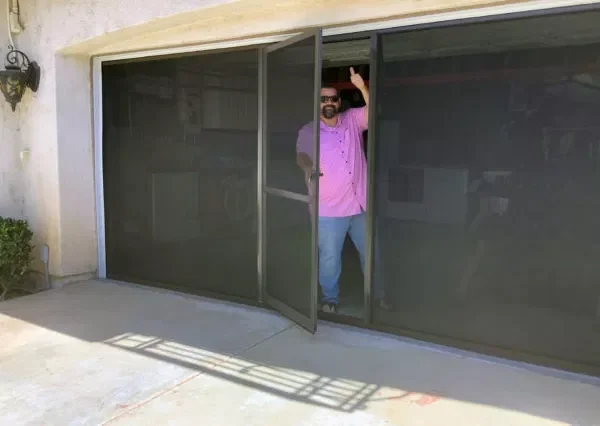 A garage screen from Lifestyle with a swinging center door.