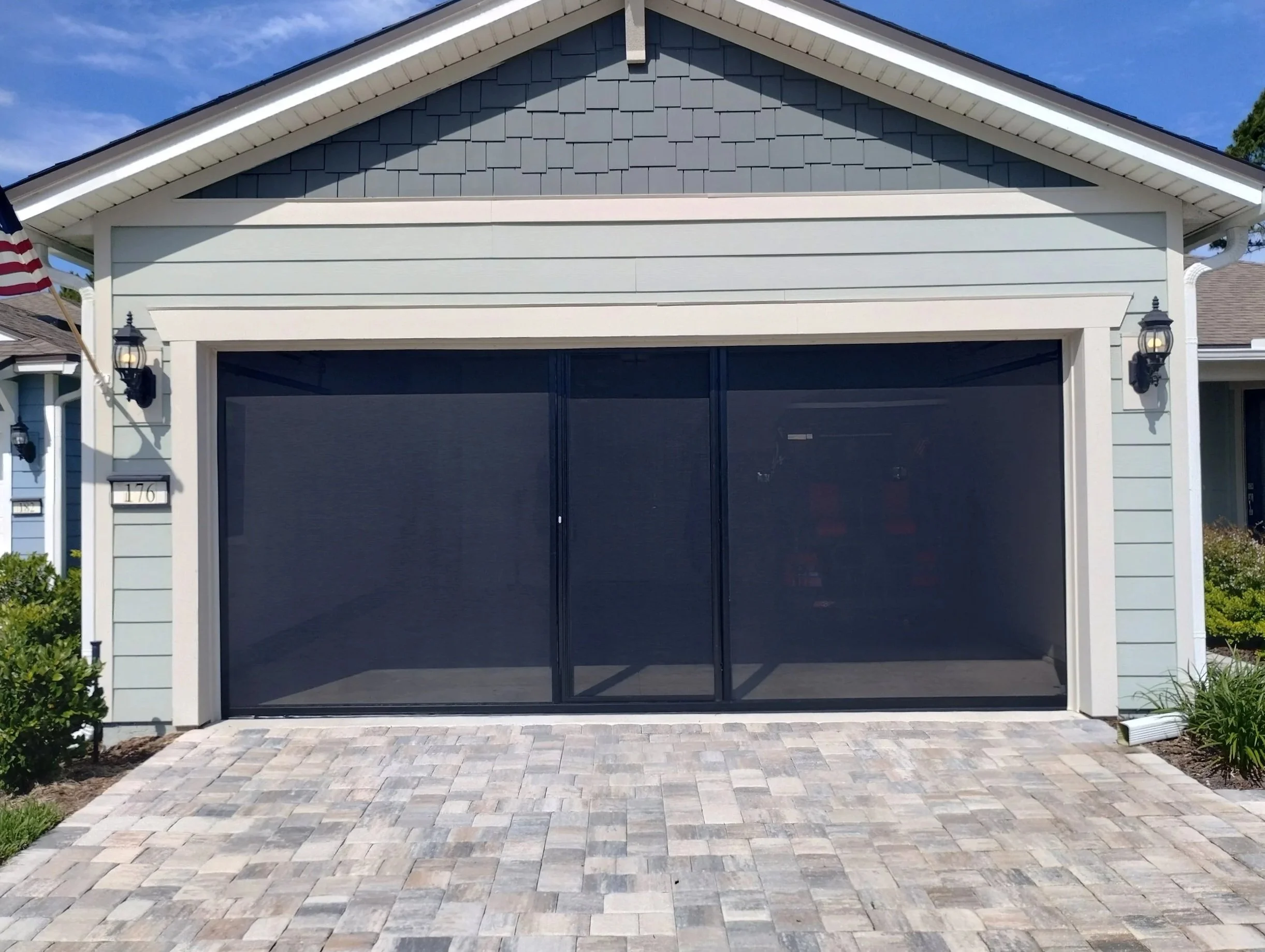A black framed with black screen Lifestyle on a new home in an HOA community.