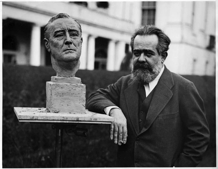 Jo Davidson with his bust of President Roosevelt at the White House in 1933.