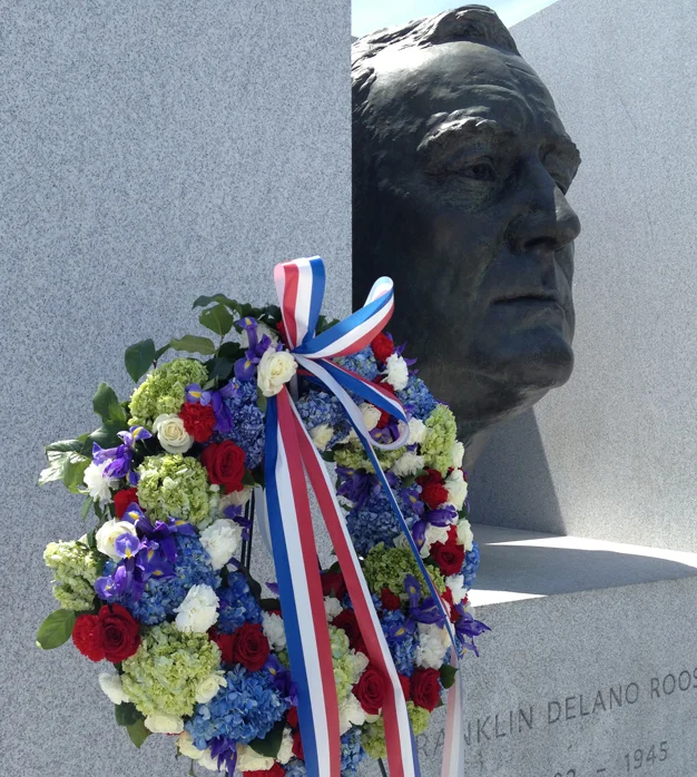 The Memorial Day wreath of roses, carnations, hydrangea and irises was placed at President Roosevelt's portrait-head.