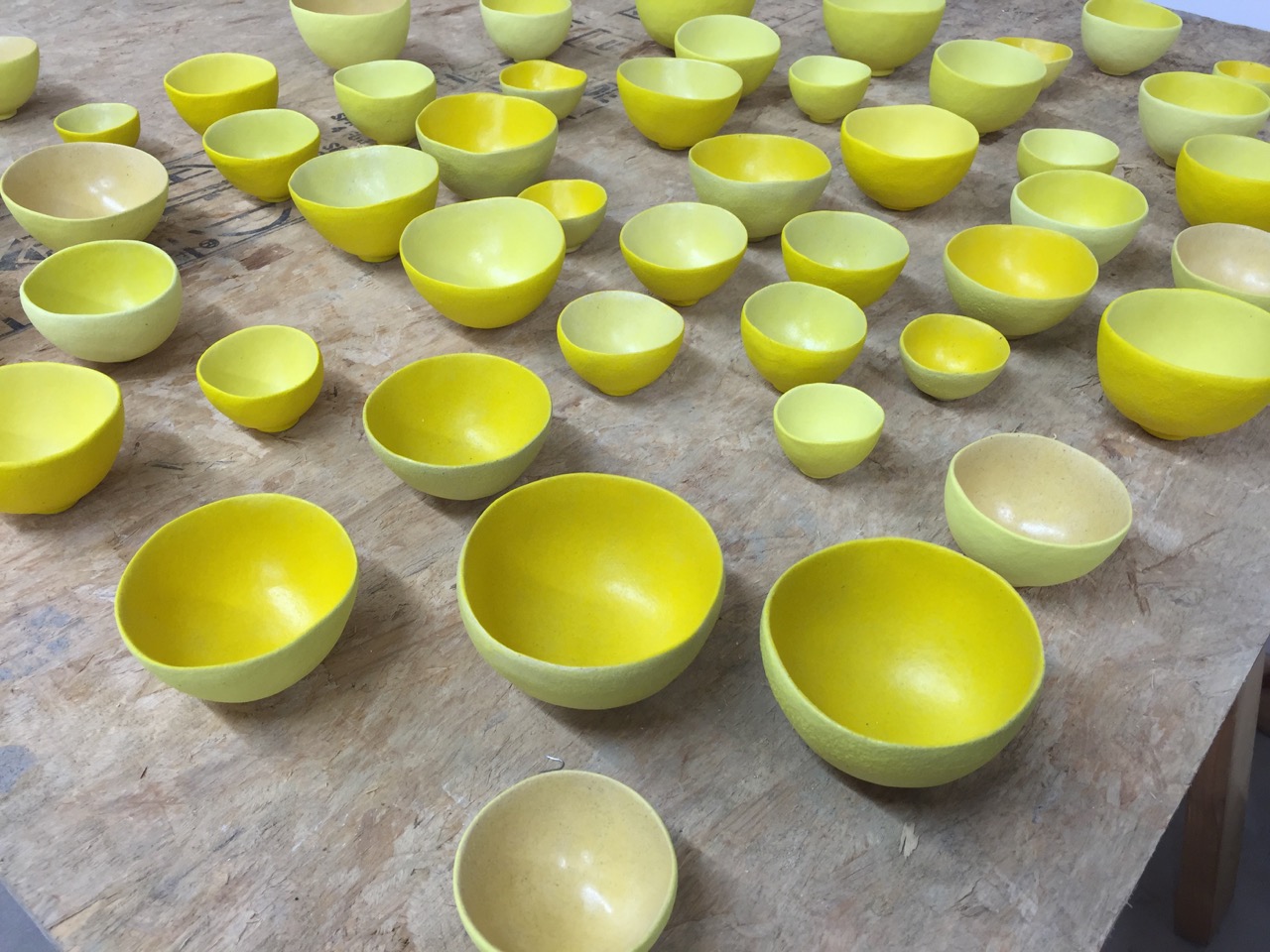 The bowls emerge from the kiln after the second firing.