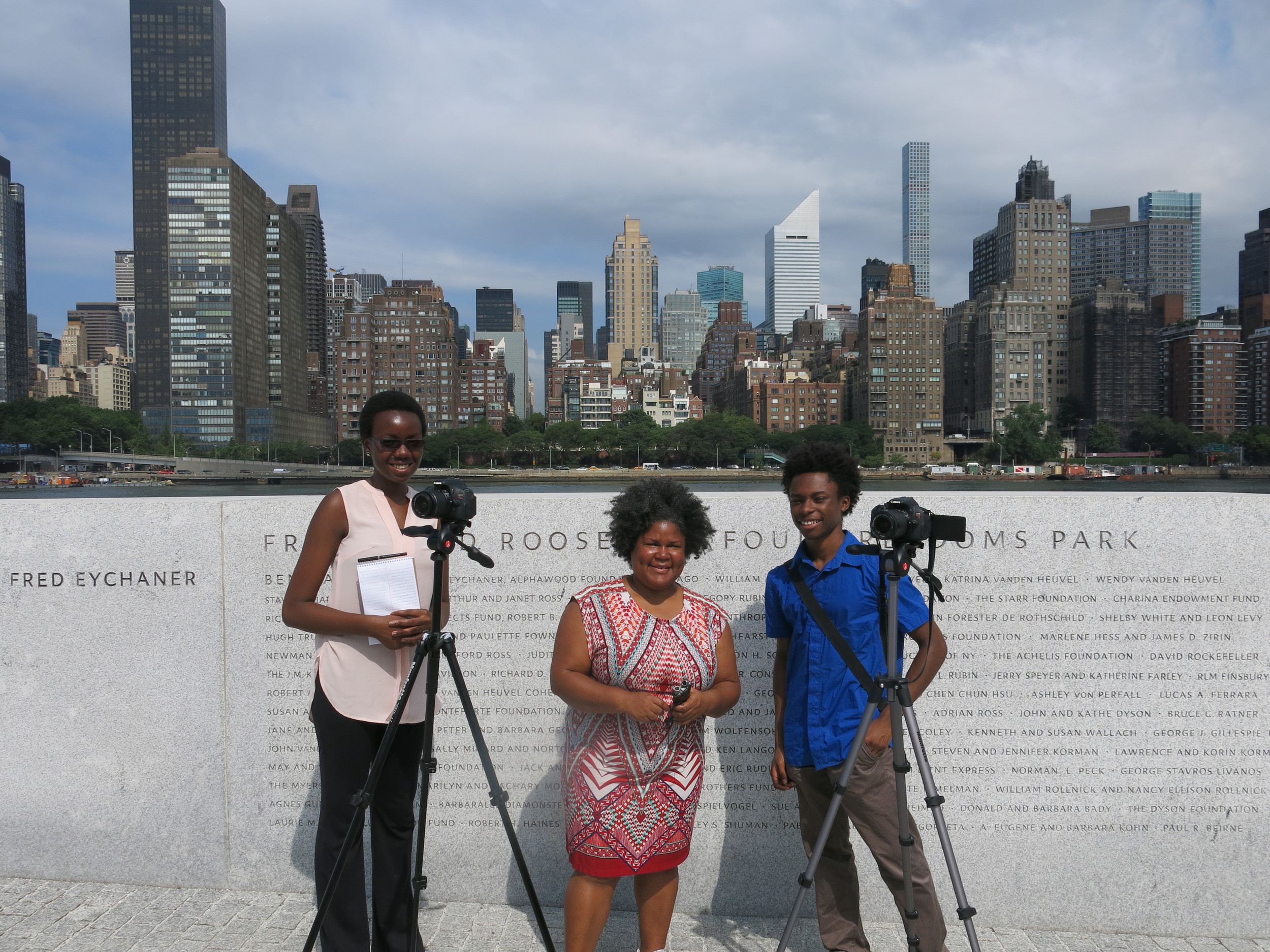 Interns Marie-Therese Ghunney (left) and Isaiah Lee (right) are working with documentary filmmaker Katherine Cheairs (center) to document stories from older New Yorkers. The interns are members of Studio in a School's Bloomberg Arts & Culture Internship Program. 