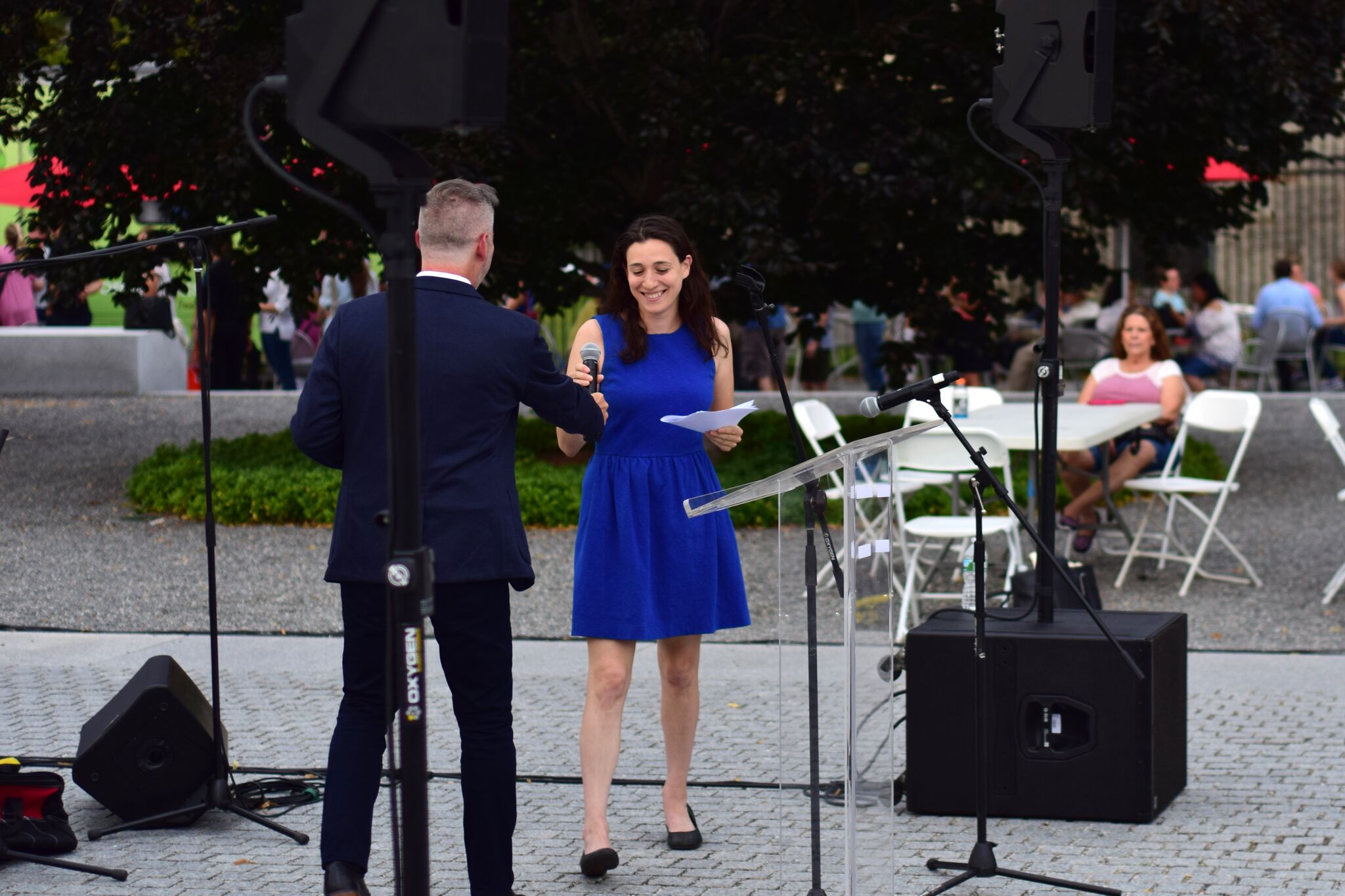 Thomas Kizmanic passes the microphone to keynote speaker Caroline Weinberg.