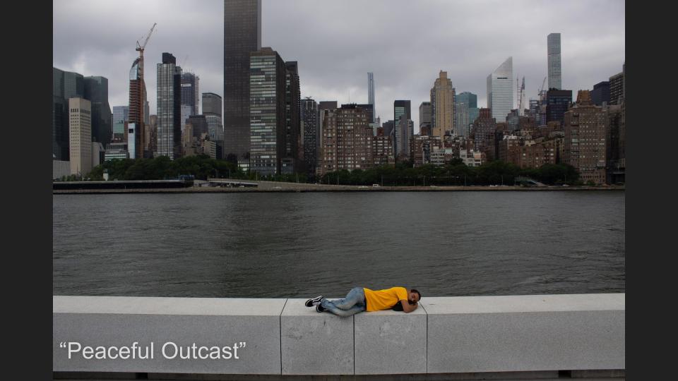JJ: Standing out or being different is totally acceptable. The boy in the picture is an outcast splash of color contrasted with the big bland city. He is still able to sleep peacefully.