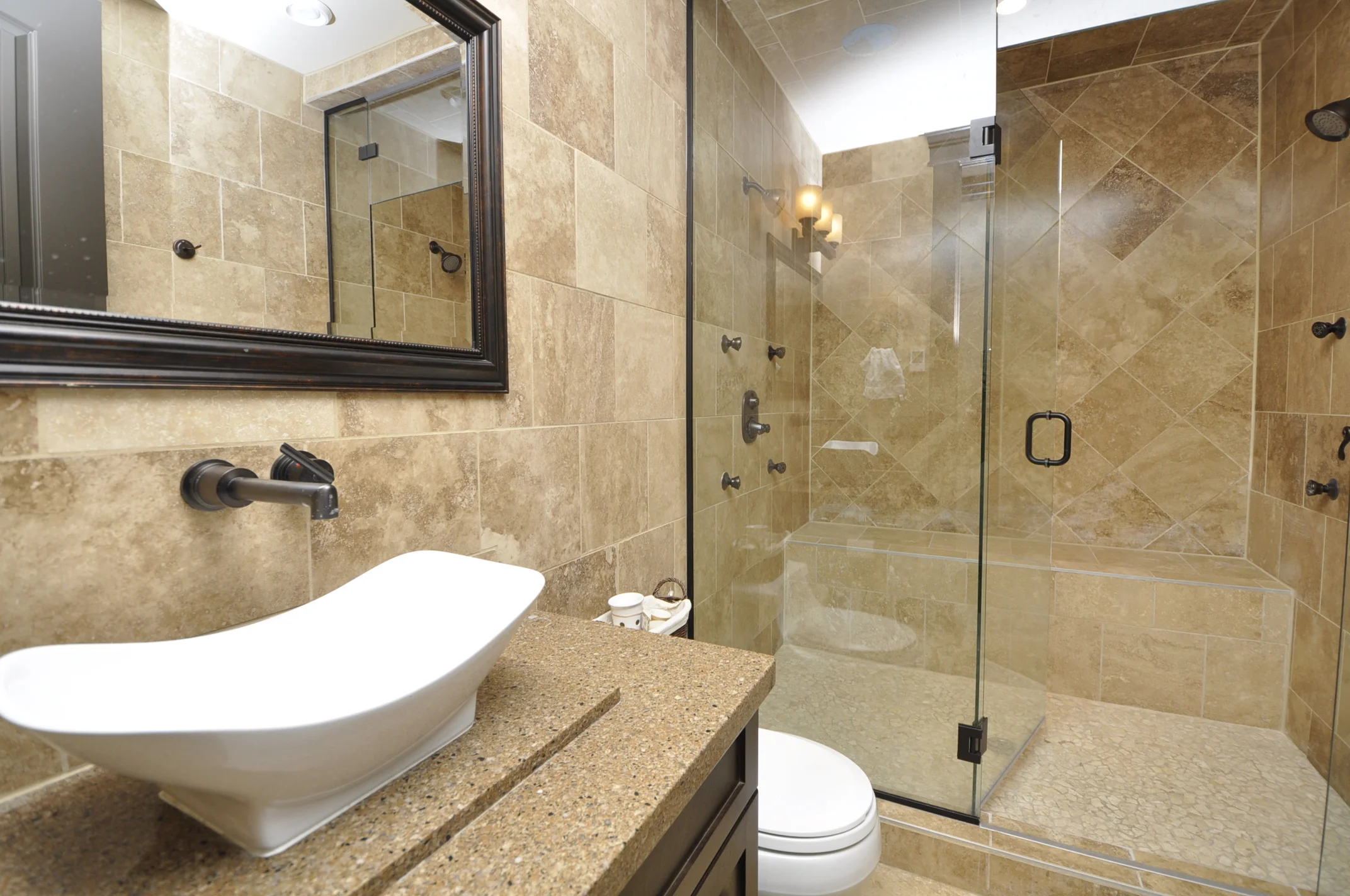 A 30 square foot steam shower complete with a bench and 2 shower groups.