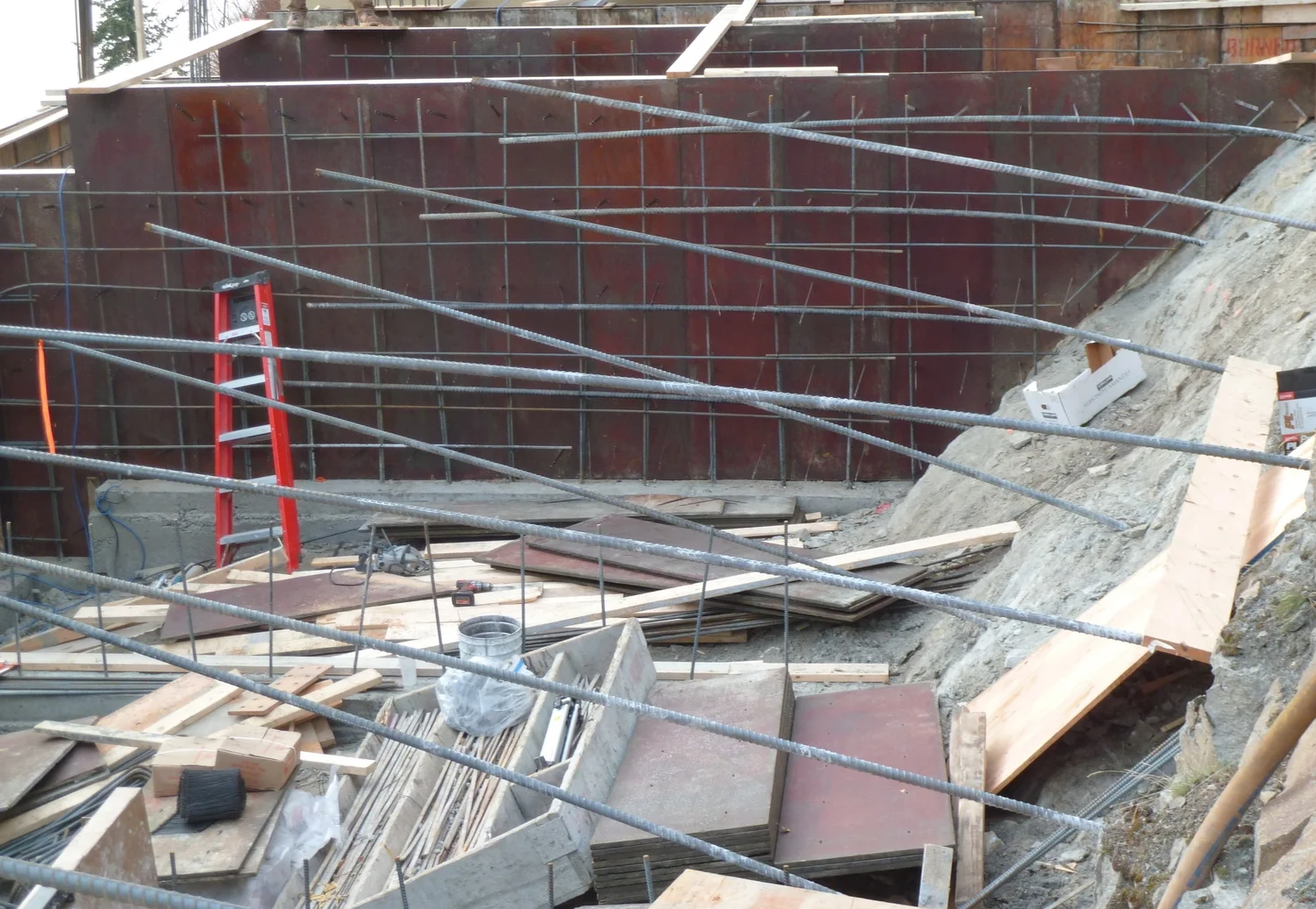 Our design included 96 rock anchors drilled 15 feet into the rock. The home and pool would literally hang off the rock face should there be any unlikely movement of the lower material.