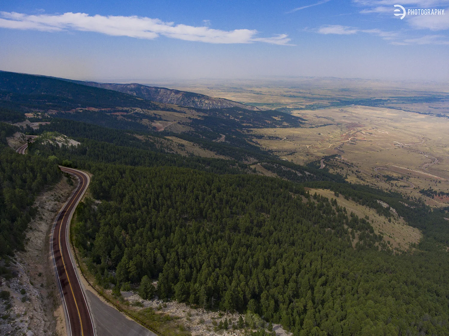 If you take the northern pass (Hwy 14) through the Bighorn National Forest near Dayton, WY - the road winds back and forth, climbing up the mountain at a rapid pace. We stopped near the top to check out the view and watch some nice young man jump of…