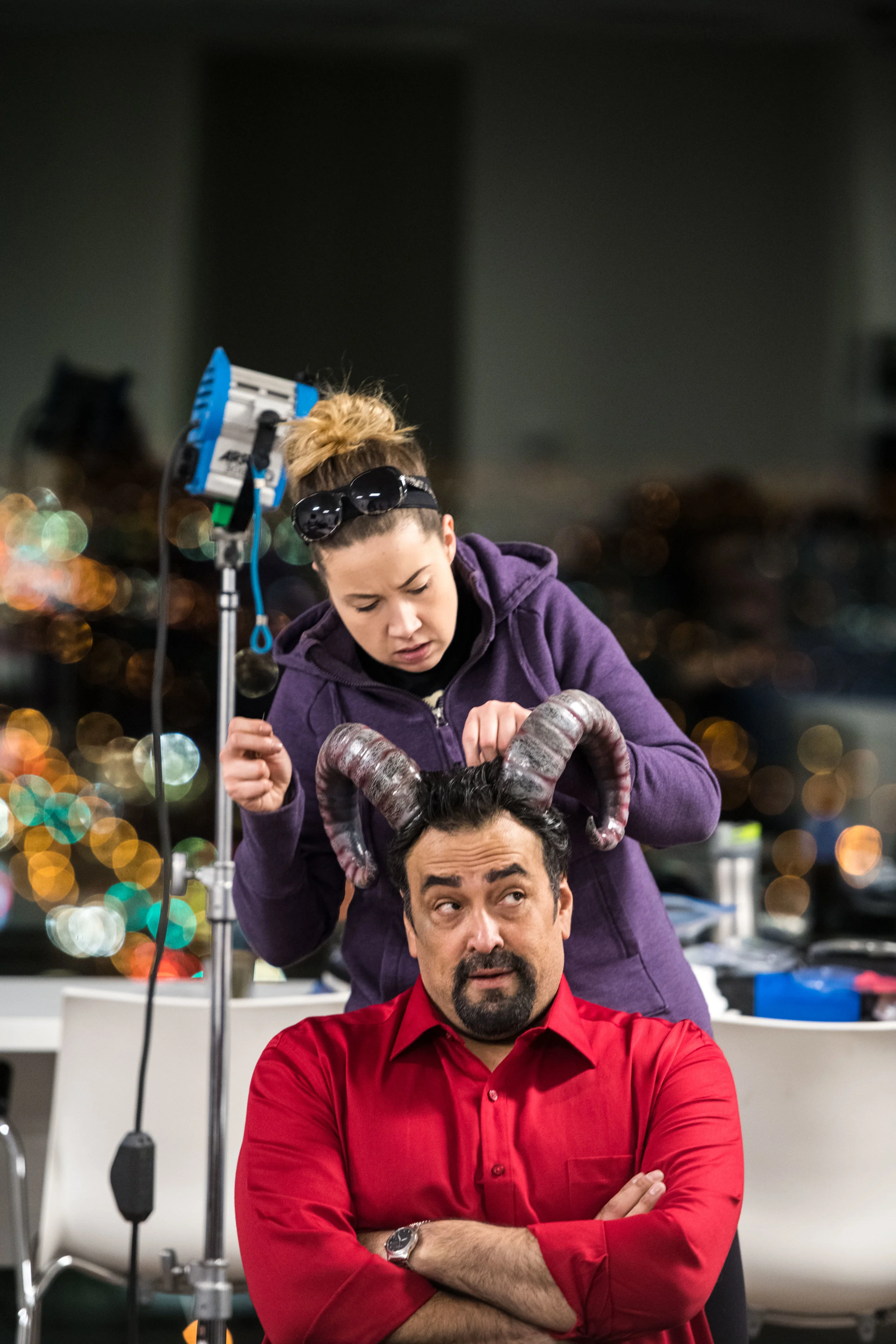 Ashly McKessock adjusts Dan Bradford’s horns. Photo Credit: Eric Kozakiewicz .