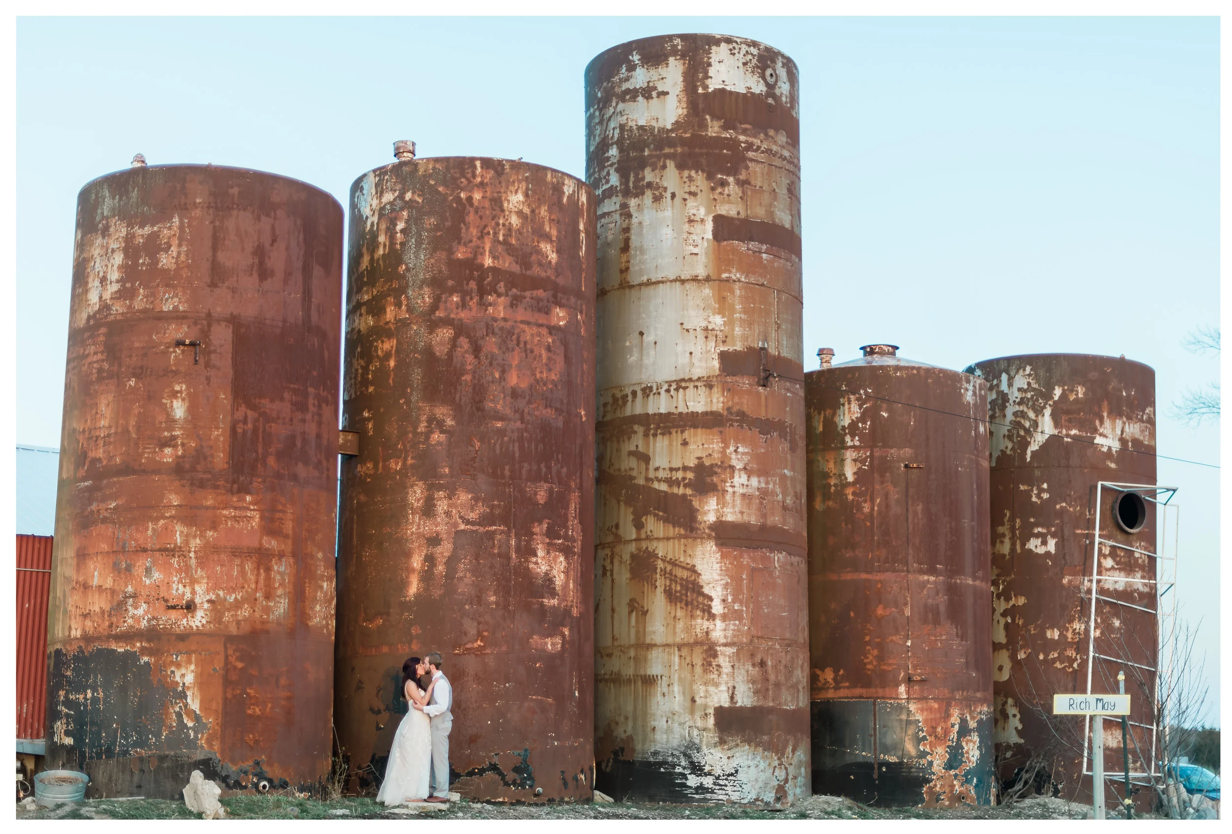 Photos under rustic silos at Apple Holler